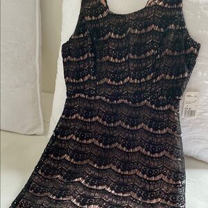 Elegant Black Lace Dress with light Cotton lining. Perfect for hot days or n